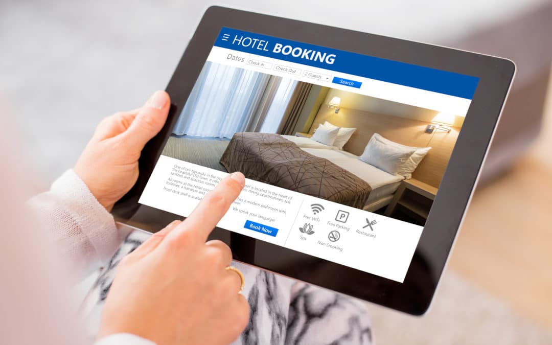 Person booking a hotel room on a tablet