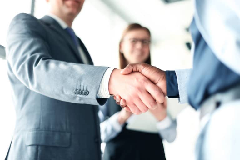 Two business people shaking hands